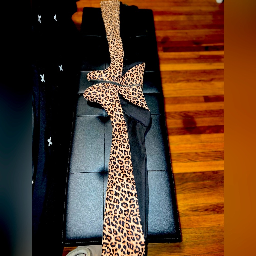 Worn, cheetah print wedge knee boots
